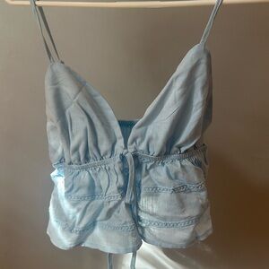 Light blue detailed tie top 
Adjustable straps